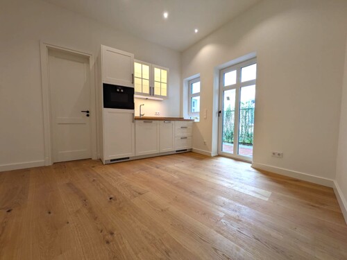 Wohn- und Essbereich mit Zugang zur Terrasse