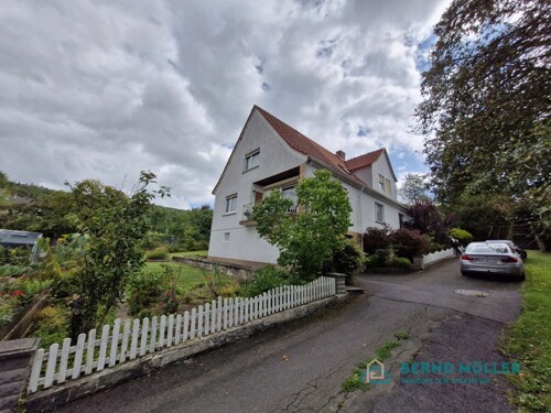 Haus mit Balkon und Gaube