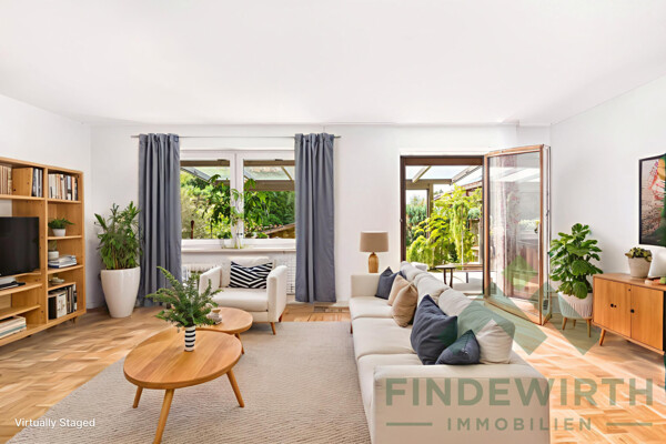 Wohnzimmer mit Zugang zur Terrasse 