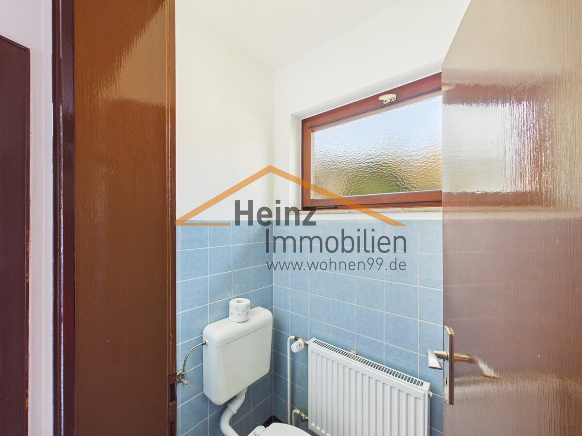 Freistehendes Einfamilienhaus mit schönem Garten und Garage - Foto 5