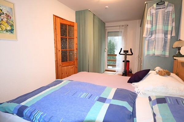 Schlafzimmer mit Balkon en Suite