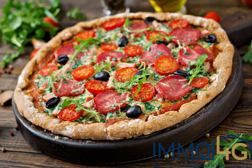 pizza-with-salami-tomatoes-olives-and-cheese-on-a-dough-with-whole-wheat-flour-italian-food