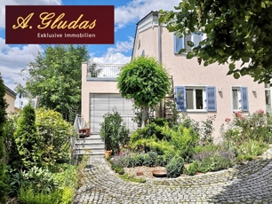 Ansicht Wintergarten mit Balkon und Terrasse