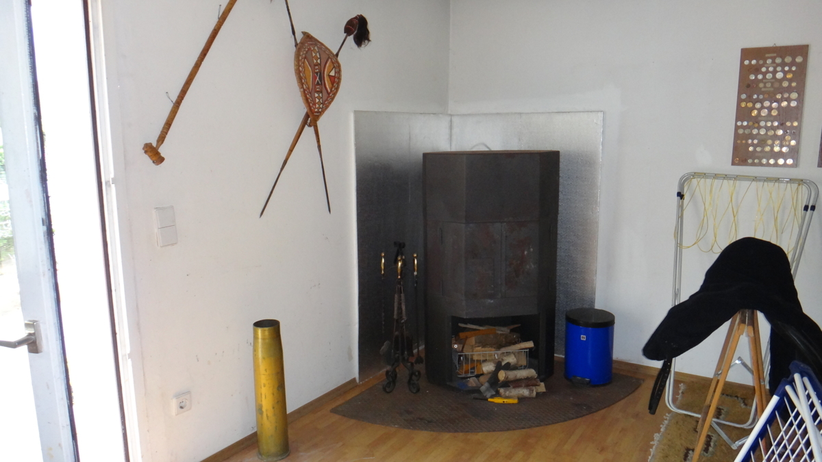 0 EG Gästehaus Wohnzimmer Kaminofen