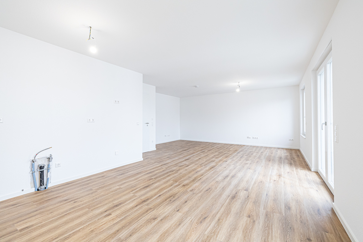 Wohn- und Esszimmer mit offener Küche_Ansicht II