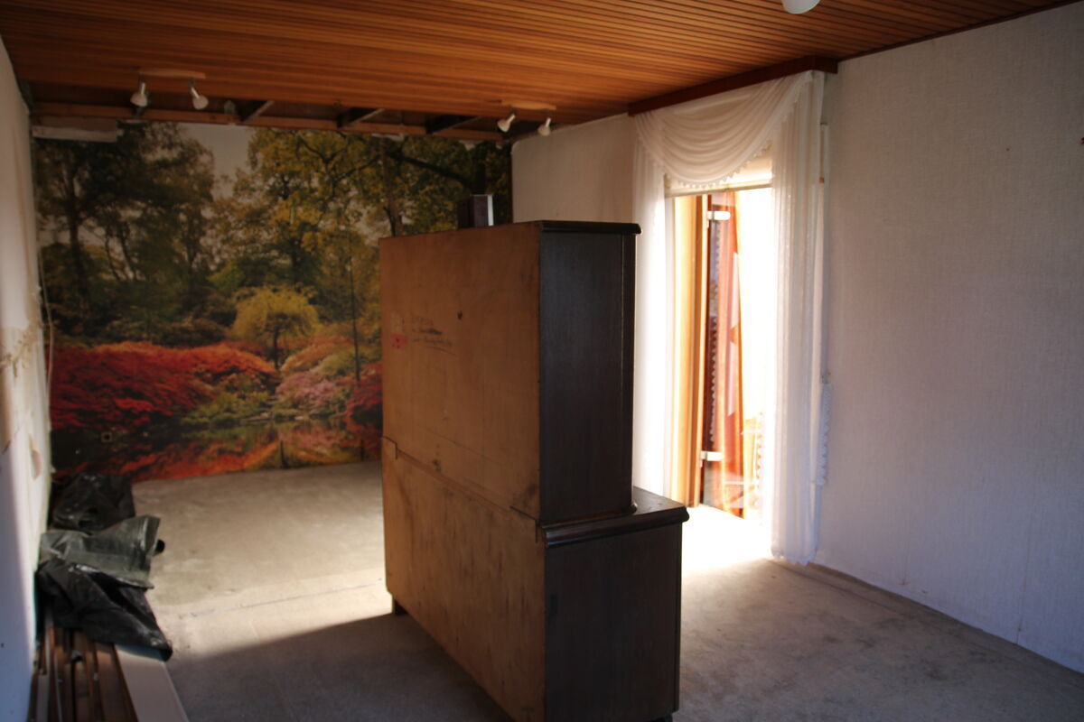 Wohnzimmer mit direktem Zugang zum Wintergarten