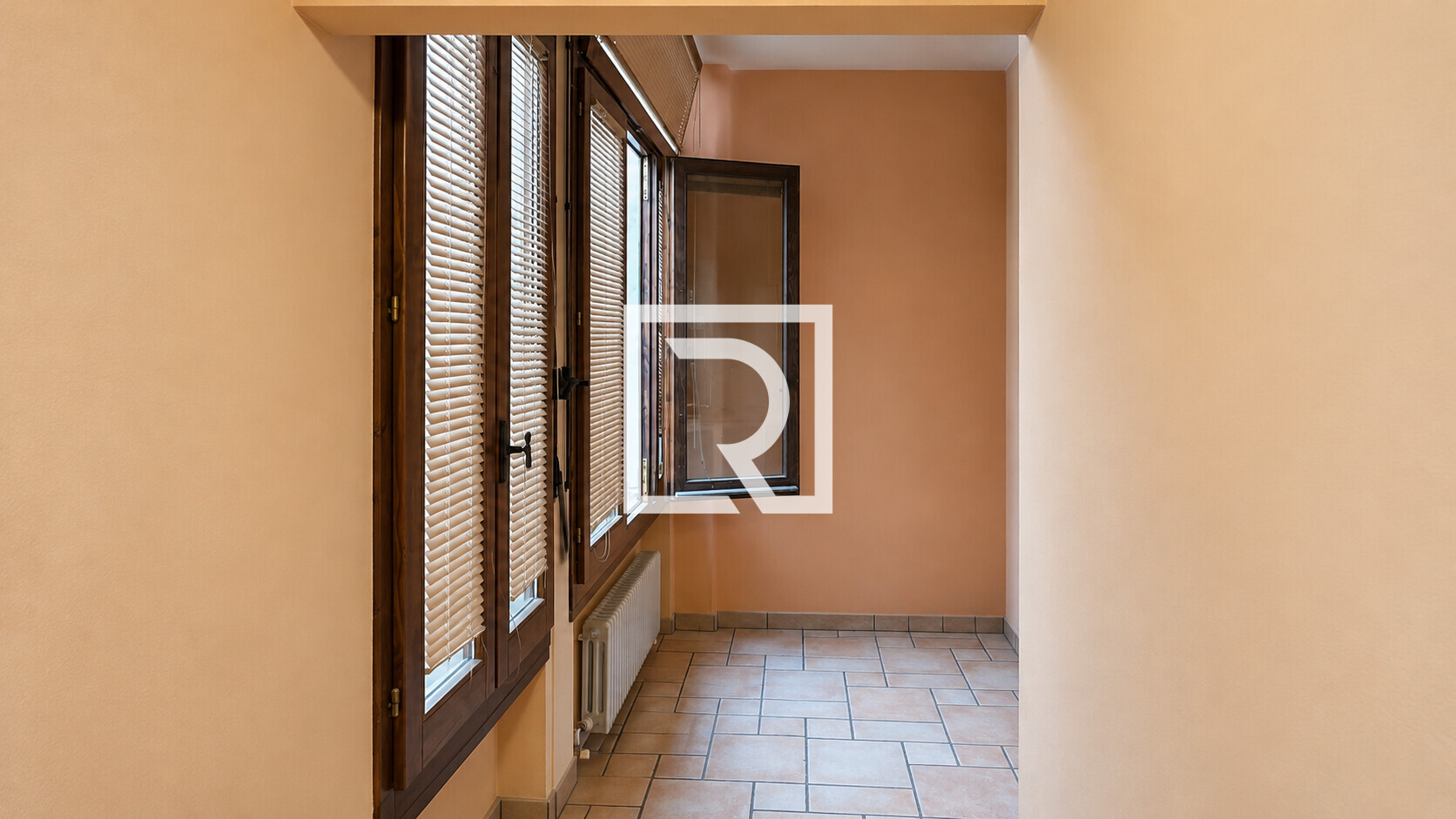 Sunlit Peach-Toned Window Corridor