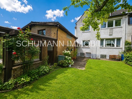 Rückansicht mit Anbau und Garten
