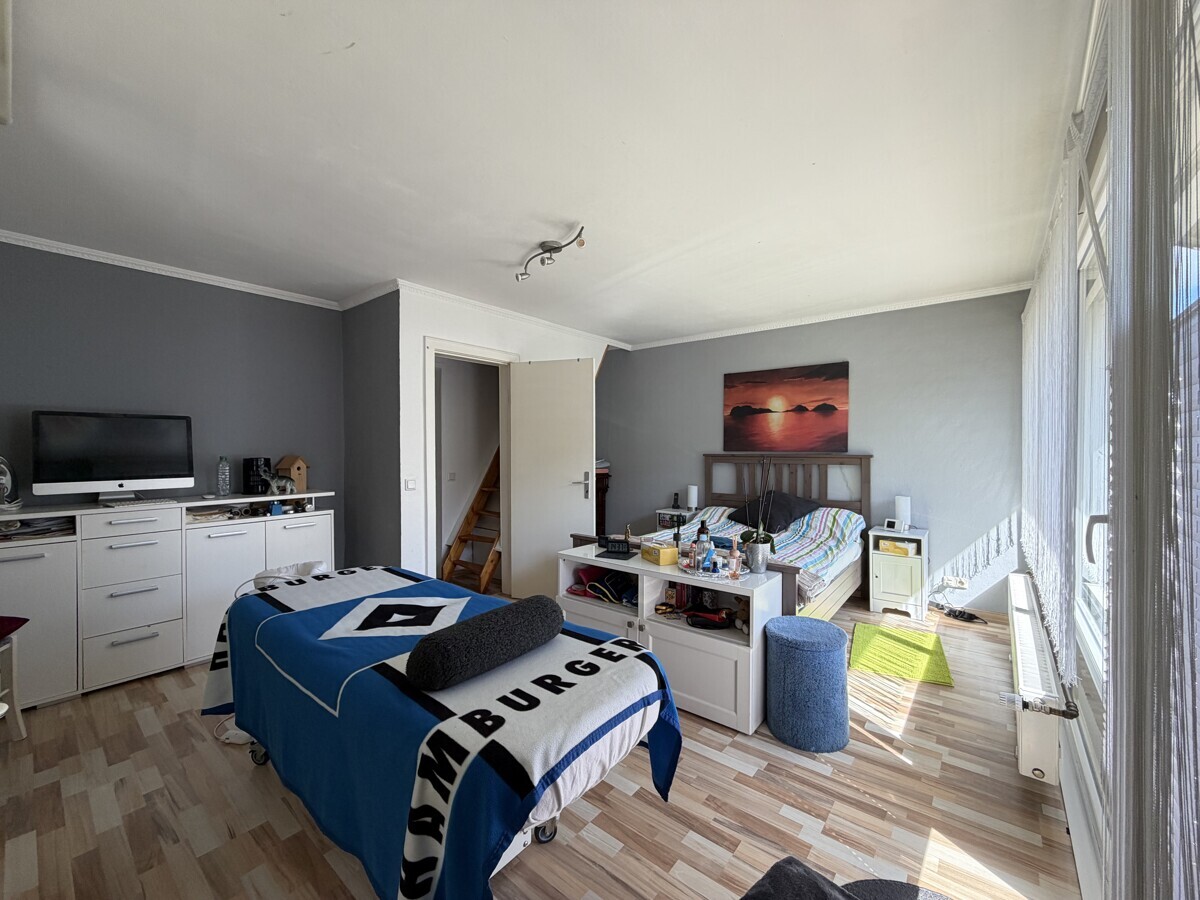 Schlafzimmer mit Balkonzugang