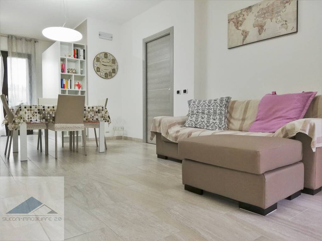 APPARTAMENTO PARI AL NUOVO CON GIARDINO E GARAGE