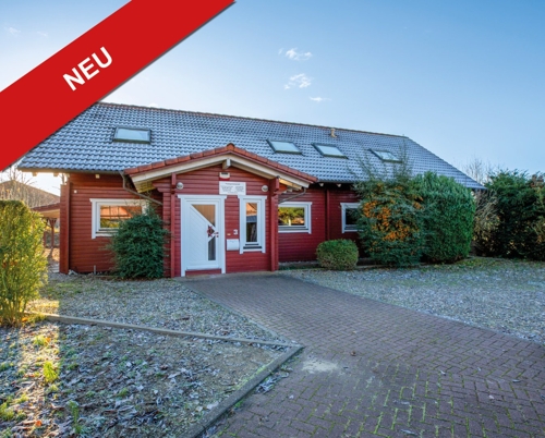 Hausfront mit NEU-Banner