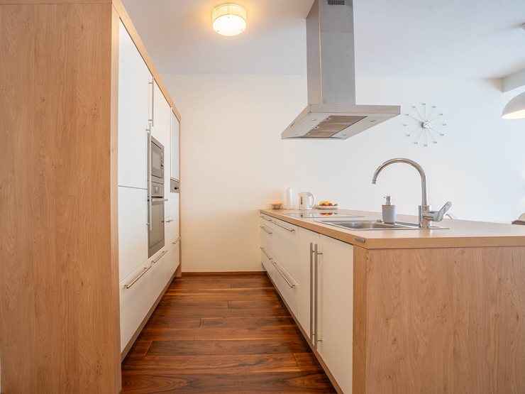 topspeed-immobilien-Küche-Steiermark-Schladming-Hochwertige,_vollmöblierte_91,75m²_Mietwohnung_mit_Tiefgarage_und_2_Schlafzimmern_im_Zentrum