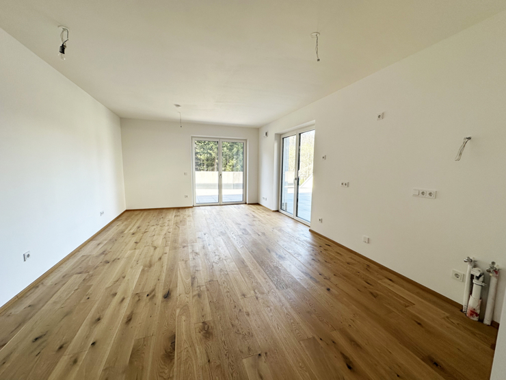topspeed-immobilien-Wohnbereich B2-Salzburg-Sankt_Johann_im_Pongau-Moderne_2-Zimmer-Gartenwohnung_mit_Terrasse_in_begehrter_Wohnlage_+_2_Tiefgaragenplätze