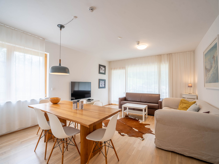topspeed-immobilien-Wohnzimmer-Steiermark-Schladming-Investment_mit_Aussicht:_Apartment_in_der_SUN_LODGE_–_81m²_Apartment,_Wellness_&_Pool