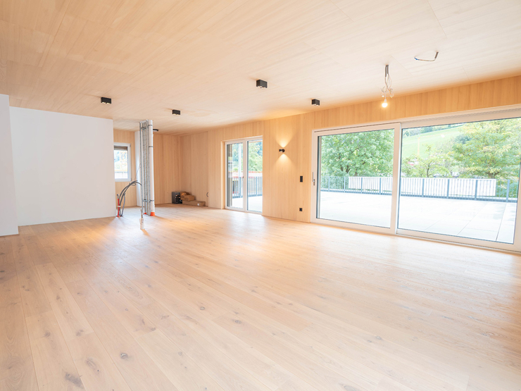 topspeed-immobilien-Wohnzimmer + Küche-Steiermark-Schladming-Luxus-Penthouse_in_Schladming:_136_m²_Wohnfläche_&_105_m²_Süd_Terrasse_nahe_der_Planai_West