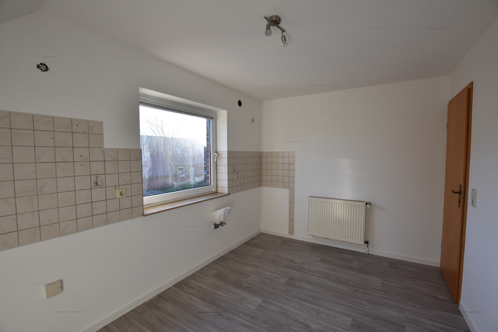 Zentral gelegene Obergeschosswohnung in Warsingsfehn - Foto 1