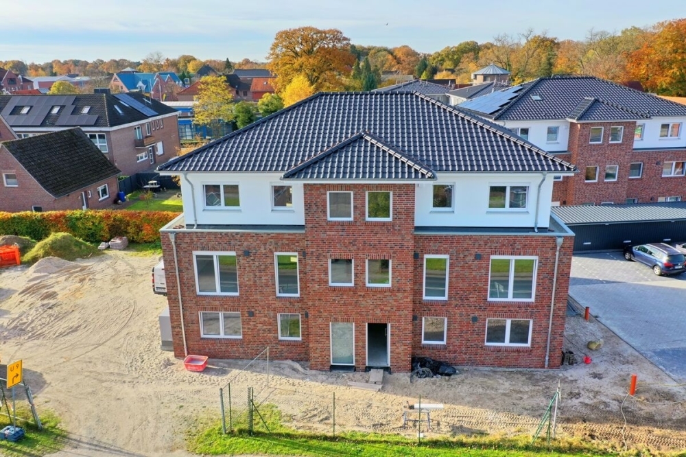 Erstbezug: Energiesparende Penthousewohnung mit Balkon im Herzen von Remels - Foto 4