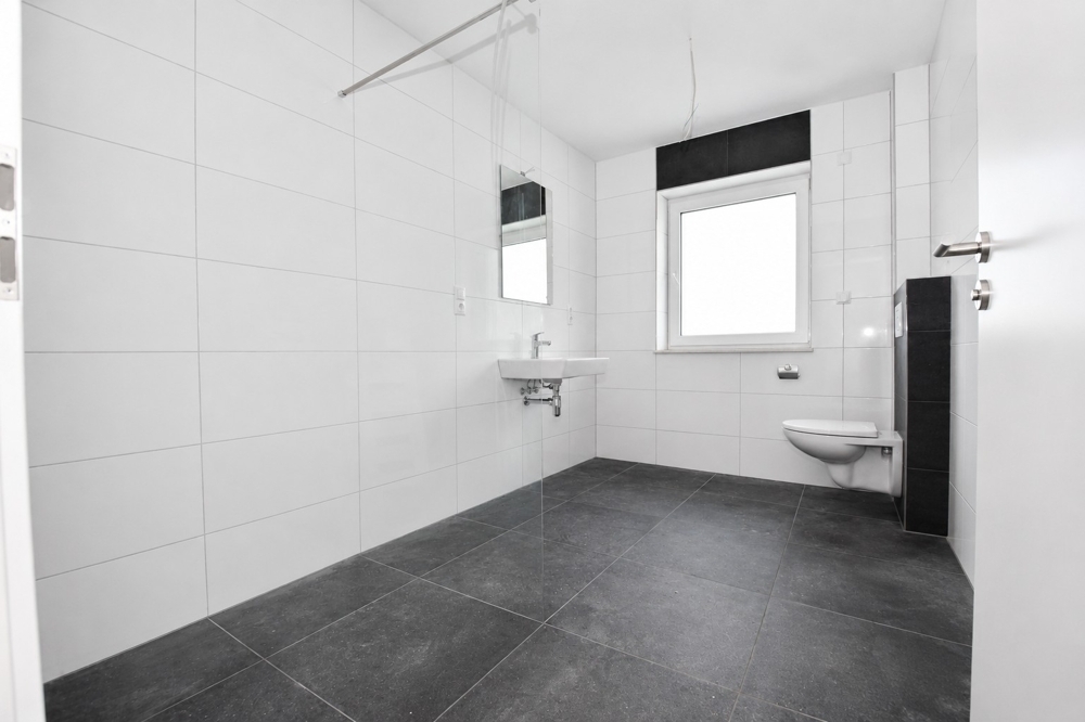 Erstbezug - Barrierefreie Neubauwohnung mit Einbauküche, überdachter Terrasse und PKW-Stellplatz in Altenoythe - Foto 4