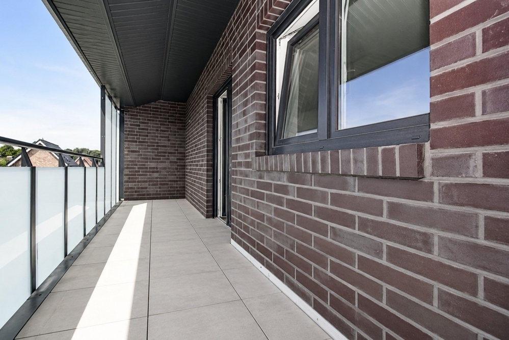 Erstbezug - Neubauwohnung mit Einbauküche, Balkon und PKW-Stellplatz in Altenoythe - Photo 5
