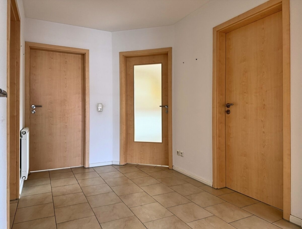 Attraktive Dachgeschosswohnung mit Einbauküche in Toplage von Wiesmoor - Foto 1