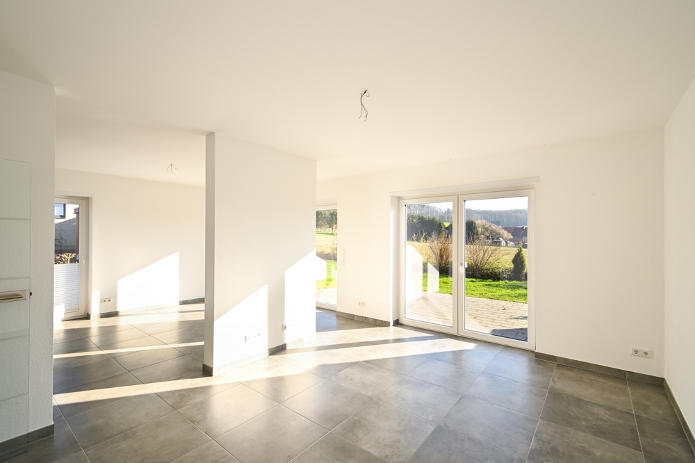 Modernes Wohnen in bester Lage – mit unverbaubarem Blick ins Grüne! - Foto 1