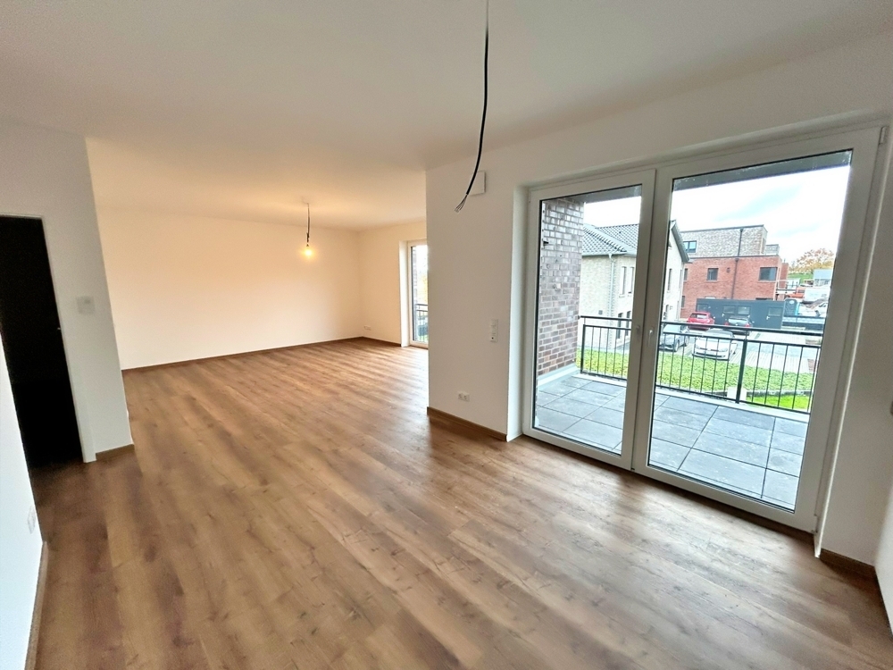 Augustfehn: Große Obergeschosswohnung mit Lift und Einbauküche | 91m² | KfW 40 - Photo 1