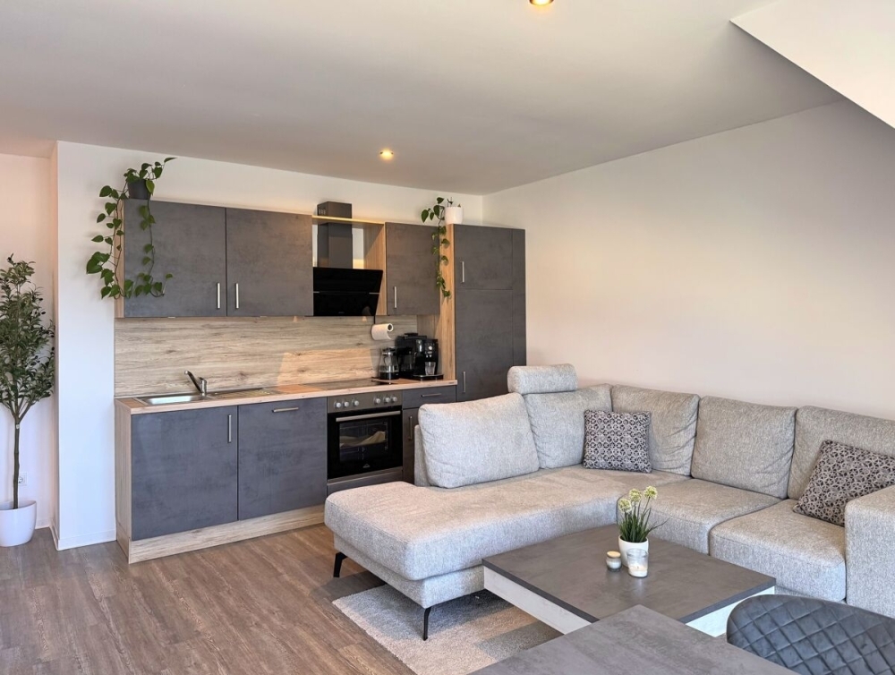 Neuwertige Singlewohnung mit Einbauküche in zentraler Lage der Blumenstadt Wiesmoor - Foto 1