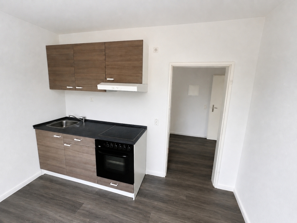 Modern sanierte 1-Zimmer-Wohnung mit Balkon, Einbauküche und Stellplatz in Jever-Rahrdum - Photo 2
