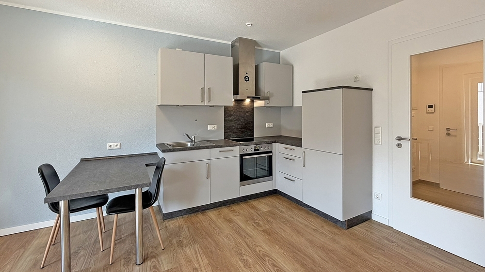 Moderne Erdgeschoss-Singlewohnung mit Terrasse und Einbauküche - Foto 2