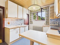 Stilvolles Zweifamilienhaus auf großzügigem Grundstück in begehrter Wohnlage von Feldkirchen – Wohnen mit Zukunftspotenzial